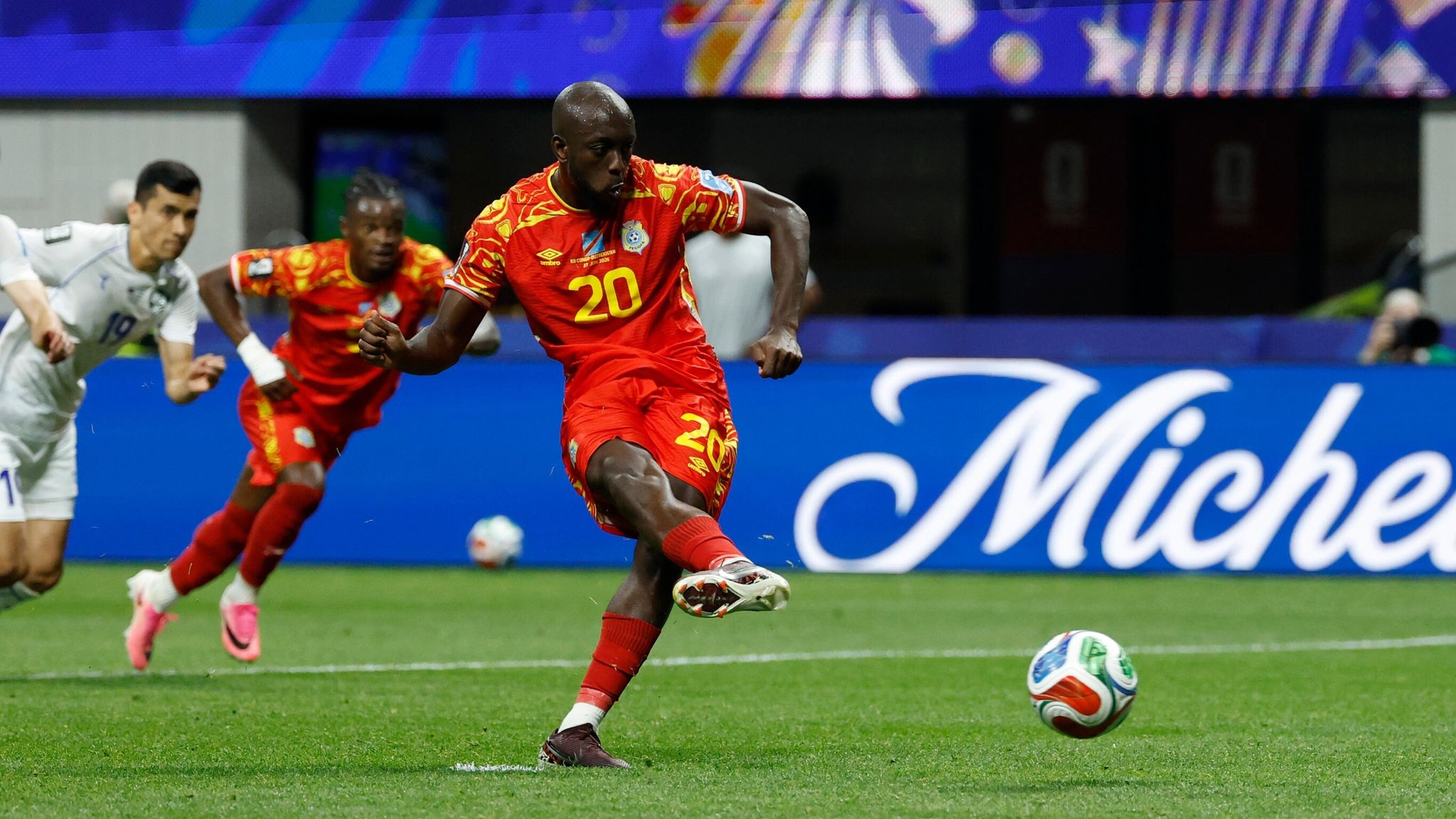 Congo's Yoane Wissa (20) kicks for a penalty kick goal during the World Cup Group K soccer match between DR Congo and Uzbekistan in Atlanta, Saturday, June 27, 2026. (AP Photo/Erik S. Lesser)