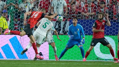 Austria's Sasa Kalajdzic heads in a 96th minute equaliser against Algeria