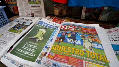 Newspaper front pages are displayed in a Madrid press kiosk following Spain's 5-1 defeat to the Netherlands at the 2014 World Cup