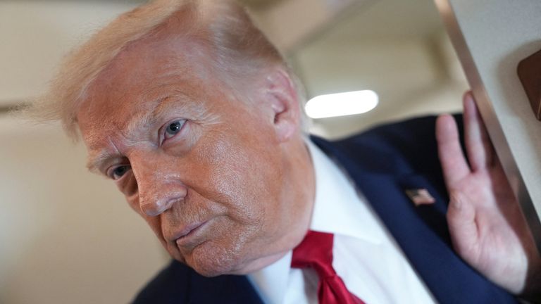 President Trump pictured on Air Force One on Friday. Pic: Reuters