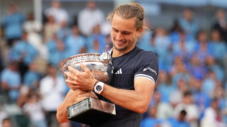 Alexander Zverev of Germany celebrates with the trophy after winning the men's final match against Flavio Cobolli of Italy at the French Open.