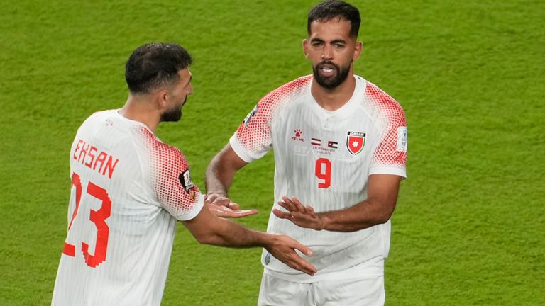 Jordan's Ali Olwan, right, celebrates with Jordan's Ehsan Haddad after scoring his side's opening goal against Austria
