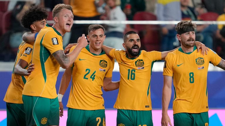 Australia players celebrate their progress to the last-32 of the World Cup