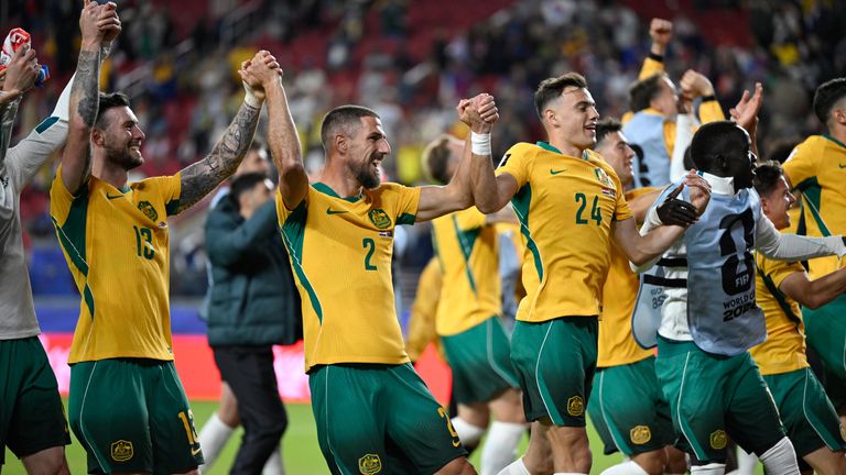Australia celebrate reaching the World Cup last-32