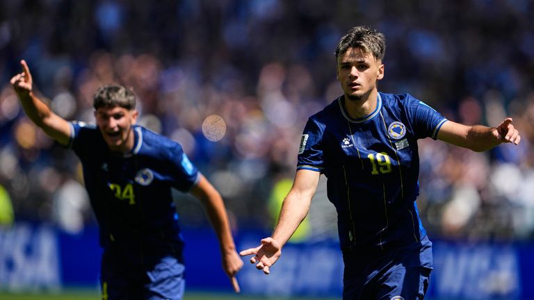 Bosnia's Kerim Alajbegovic, right, celebrates after scoring his side's opening goal during the World Cup Group B soccer match against Qatar in Seattle, Wednesday, June 24, 2026. (AP Photo/Lindsey Wasson)