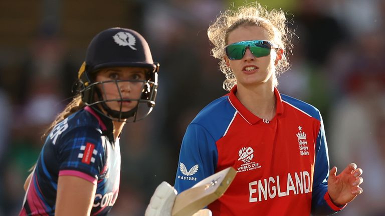 Charlie Dean of England and Darcey Carter of Scotland looks on during the ICC Women's T20 World Cup Group B match between England and Scotla
