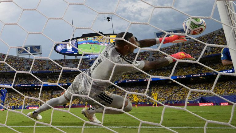 Curacao's goalkeeper #01 Eloy Room makes a save during the 2026 World Cup Group E football match between Ecuador and Curacao