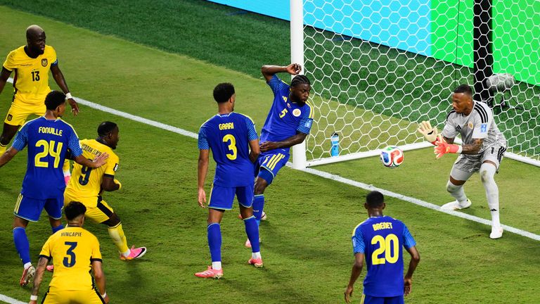 Curacao goalkeeper Eloy Room, right, makes a save during the World Cup Group E soccer match between Ecuador 