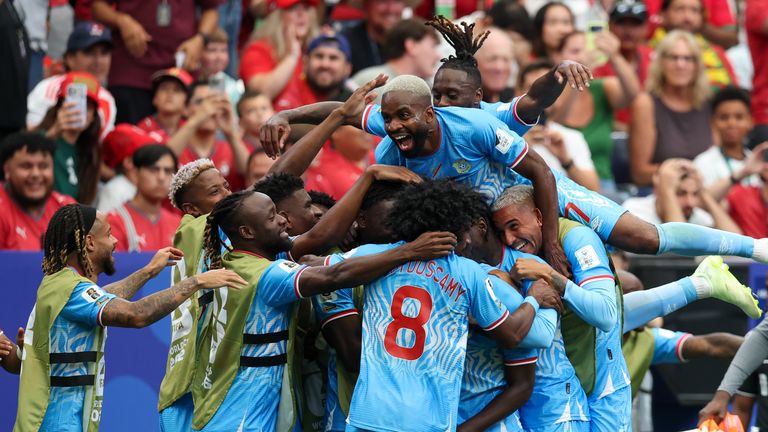 Dr Congo players celebrate scoring their first ever goal at a World Cup