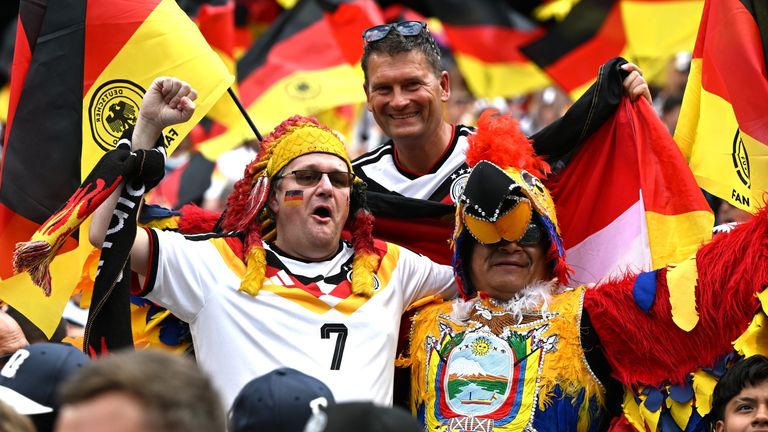 25 June 2026, USA, East Rutherford: Soccer, Men, 2026 World Cup, Ecuador vs. Germany, Group Stage, Group E, Matchday 3, New York...New Jersey Stadium...a Germany fan and an Ecuador fan are standing together in the stands before the game. PLEASE NOTE: In accordance with FIFA regulations, these images may be used exclusively for editorial purposes. Commercial use is prohibited. Furthermore, no video-like sequences may be created, and no alterations may be made to the image, either in the foreground or the background. Photo by: Federico Gambarini/picture-alliance/dpa/AP Images