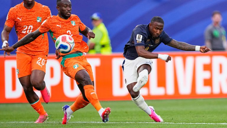Ecuador's John Yeboah takes a shot at goal as Ivory Coast's Ghislain Konan reacts during the World Cup Group E soccer match