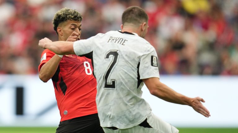 New Zealand's Tim Payne (2) passes around Egypt's Emam Ashour (8) during the World Cup Group G soccer match between New Zealand and Egypt in Vancouver, British Columbia, Sunday, June 21, 2026. (AP Photo/Abbie Parr)