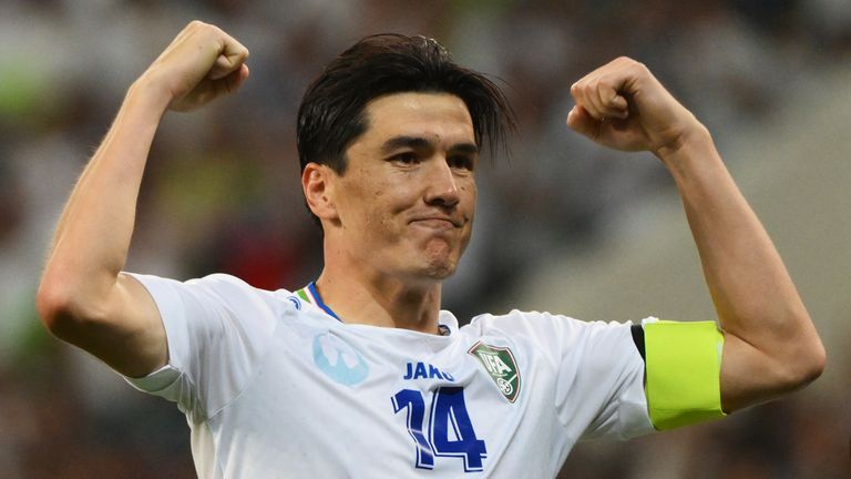 Eldor Shomurodov celebrates scoring for Uzvekistan in World Cup qualifying