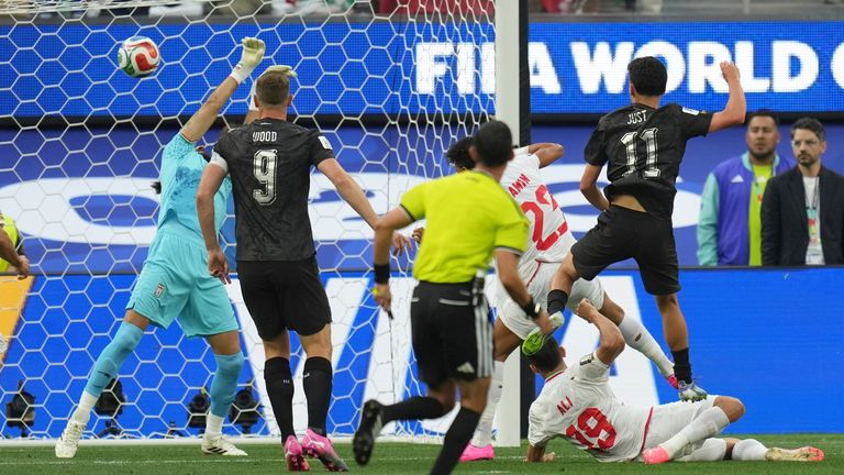 New Zealand's Elijah Just scores the opening goal during the World Cup Group G soccer match against Iran