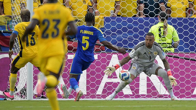 Curacao's goalkeeper #01 Eloy Room makes a save past Ecuador's forward #13 Enner Valencia during the 2026 