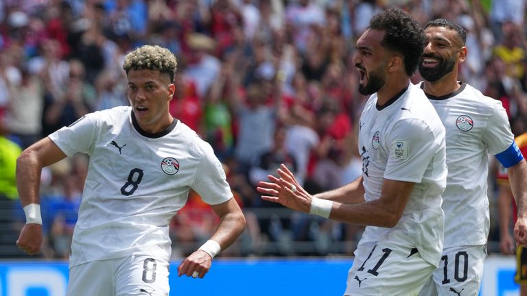 Egypt's Emam Ashour, left, celebrates after scoring the opening goal during the World Cup Group G soccer match between Belgium and Egypt