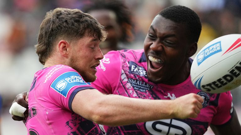 Jack Farrimond of Wigan Warriors chases his chip and scores the fourth try