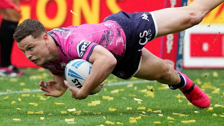 Jai Field of Wigan Warriors goes over for the first try