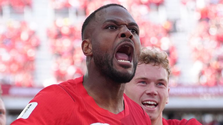 Cyle Larin celebrates with teammates after scoring Canada's equaliser against Bosnia-Herzegovina