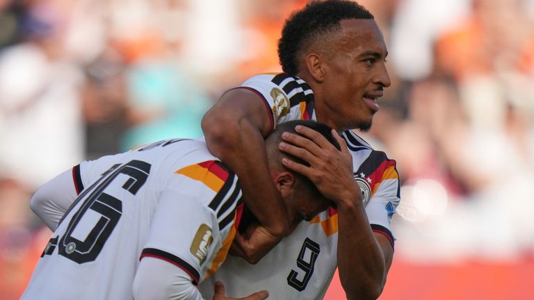 Deniz Undav , left, celebrates with Jamie Leweling after scoring against Ivory Coast