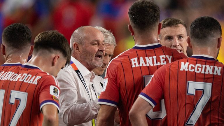 Scotland manager Steve Clarke gives his players instructions during a water break against Haiti