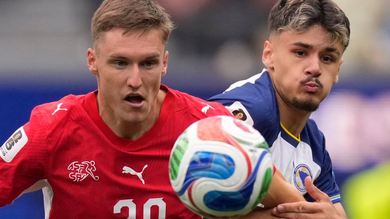 Switzerland's Michel Aebischer battles for the ball with Kerim Alajbegovic of Bosnia and Herzegovina
