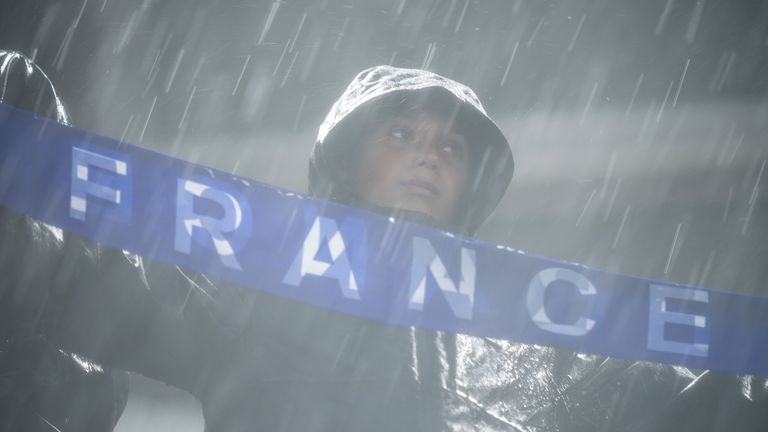 Fans of France reacts after a weather delay during the World Cup Group I soccer match between France and Iraq in Philadelphia