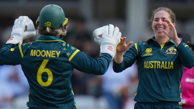 Australia's Georgia Wareham , centre, celebrates with teammates the wicket of West Indies' captain Hayley Matthews