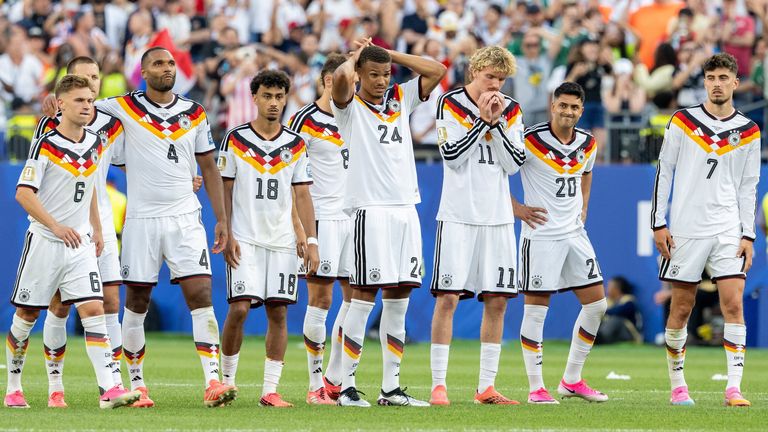 Germany players react after being knocked out of the World Cup by Paraguay