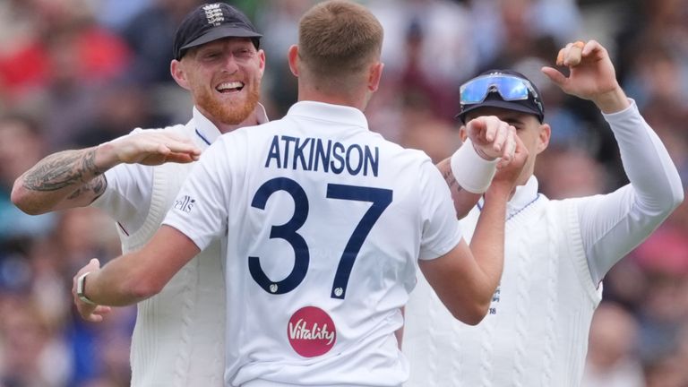 England's Gus Atkinson and Ben Stokes celebrate the wicket of New Zealand's Kyle Jamieson, after he was caught by England's Ben Duckett on d