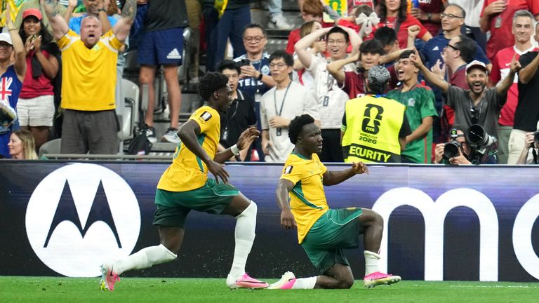 Australia's Nestory Irankunda, right, celebrates with Mohamed Toure (9) after scoring their opening goal during the World Cup Group D soccer match between Australia and Turkey in Vancouver, British Columbia, Saturday, June 13, 2026. (AP Photo/Abbie Parr)