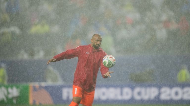 Iraq goalkeeper Fahad Talib warms up following a weather delay during the World Cup Group I match between France and Iraq in Philadelphia
