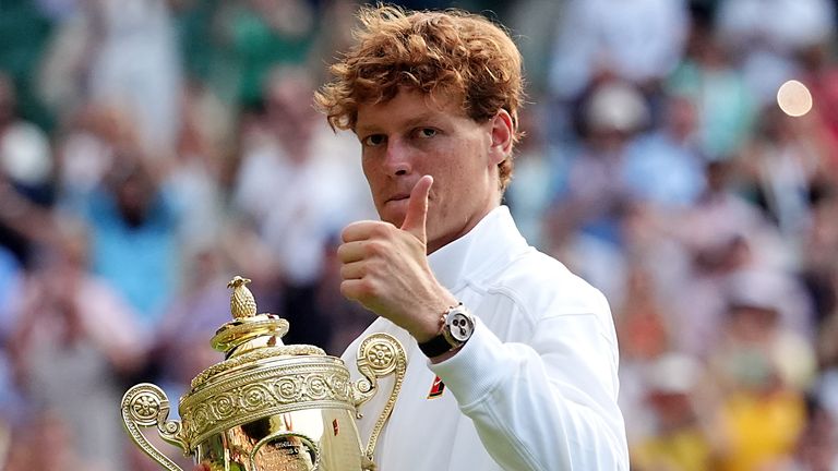 Jannik Sinner with the Gentlemen's Singles Trophy following his victory over Carlos Alcaraz on day fourteen of the 2025 Wimbledon Championsh