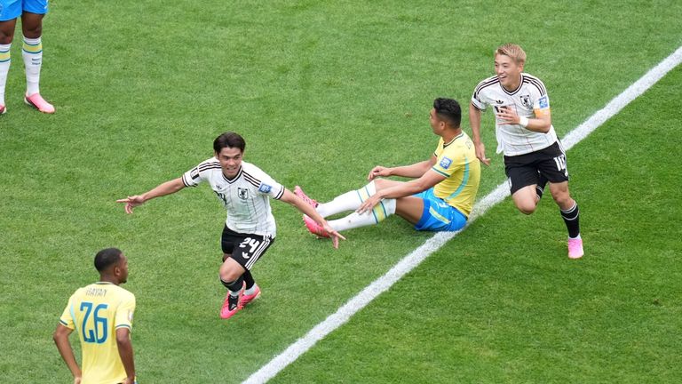 Japan's Kaishu Sano celebrates after scoring his side's first goal 