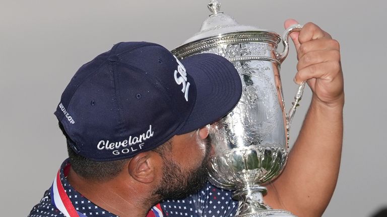 J.J. Spaun celebrates with the trophy after winning the U.S. Open golf tournament at Oakmont Country Club Sunday