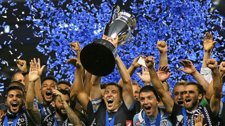 KANSAS CITY, KS - SEPTEMBER 20: Sporting Kansas City defender Matt Besler (5) hoists the Lamar Hunt US Open Cup trophy after their win over the  New York Red Bulls on September 20, 2017 at Children's Mercy Park in Kansas City, KS.  Sporting Kansas City won 2-1. (Photo by Scott Winters/Icon Sportswire)