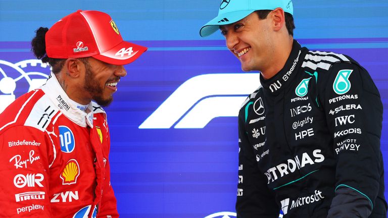 Lewis Hamilton and George Russell share a joke after qualifying on the front row in Barcelona