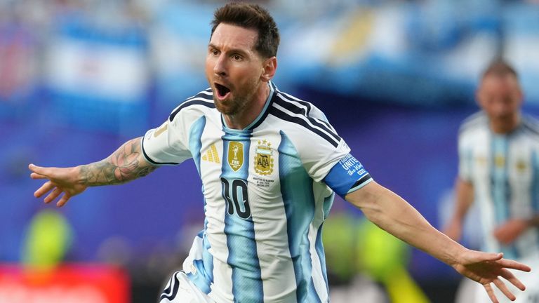 Argentina's Lionel Messi (10) celebrates after scoring the opening goal against Algeria