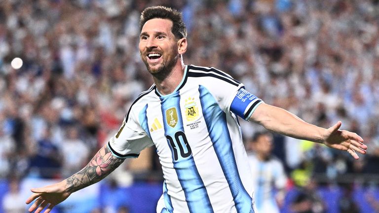 Lionel Messi celebrates scoring a hat-trick against Algeria