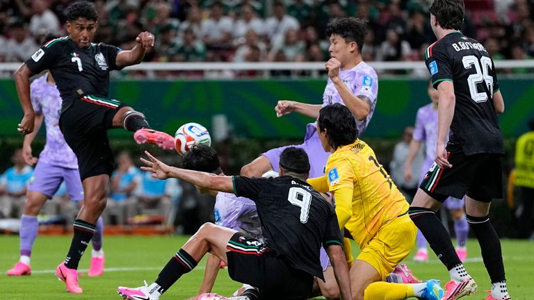 Mexico's Luis Romo (7), left, scores the opening goal during the World Cup Group A soccer match between Mexico and South Korea in Zapopan, near Guadalajara, Mexico, Thursday, June 18, 2026. (AP Photo/Ricardo Mazalan)