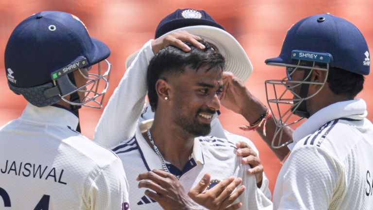 Manav Suthar (centre) took seven wickets on debut to lead India to their largest ever Test victory against Afghanistan 