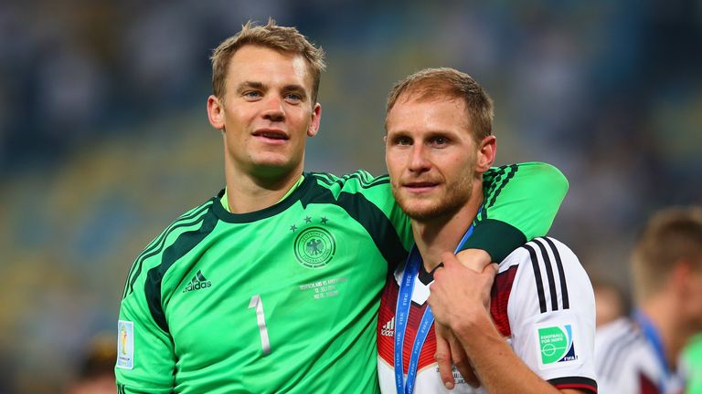 Manuel Neuer and Benedikt Howedes celebrate after the 2014 FIFA World Cup final win for Germany over Argentina