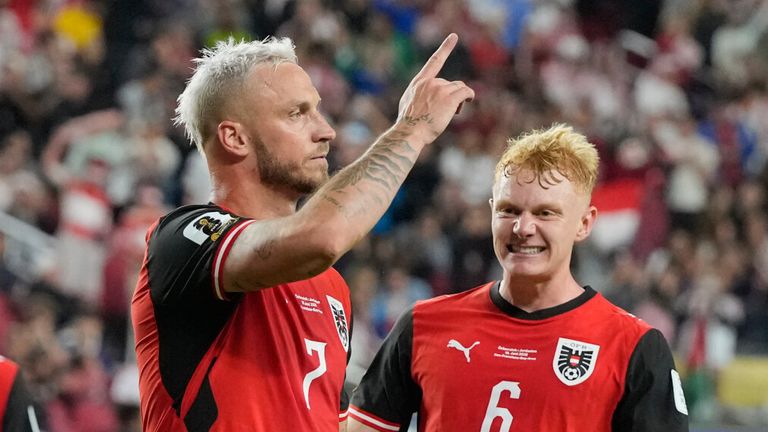 Austria's Marko Arnautovic (7) celebrates after scoring on a penalty kick during the World Cup Group J soccER)