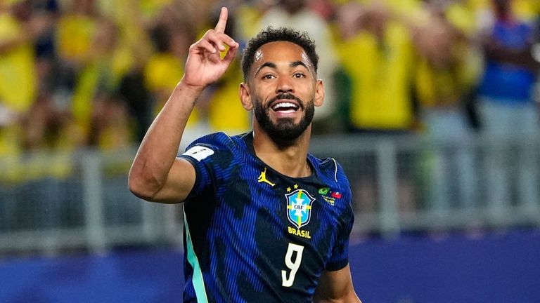 Brazil's Matheus Cunha (9) celebrates after scoring his side's opening goal during the World Cup Group C soccer 