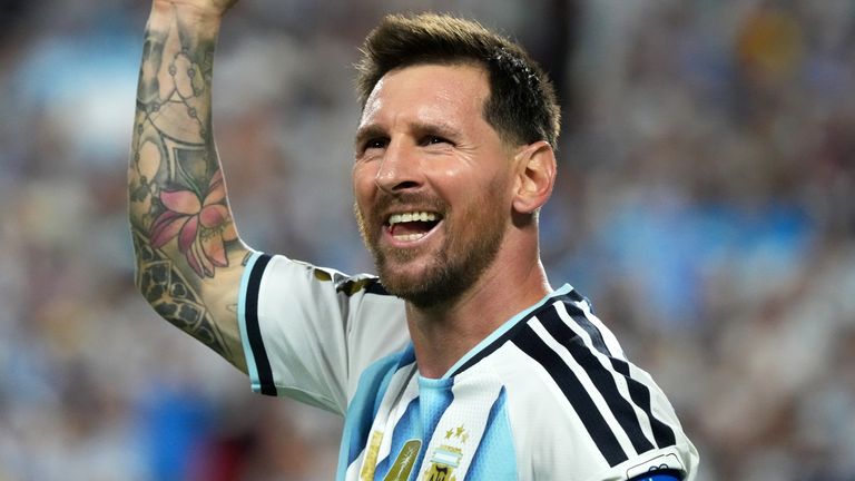 Lionel Messi celebrates his hat-trick