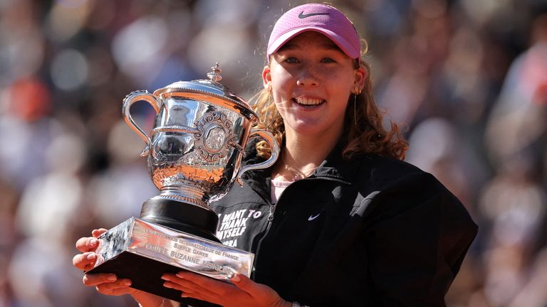 Russia's Mirra Andreeva holds the trophy after winning the French Open tennis tournament women's singles final match against Poland's Maja C