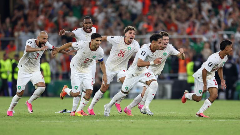 The Moroccan team starts to celebrate after winning on penalty kicks the World Cup round of 32 soccer match between the Netherlands
