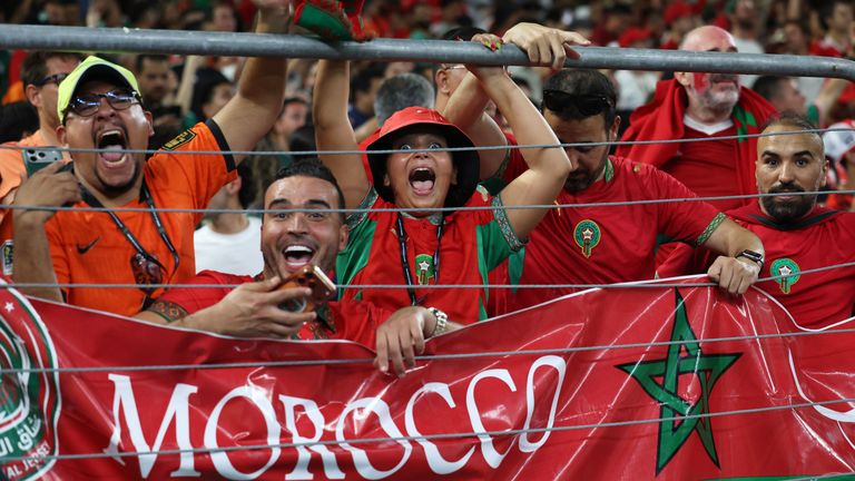 Moroccan fans celebrate after their team won on penalty kicks in the World Cup round of 32 soccer match between the Ne