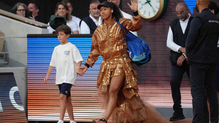 Japan's Naomi Osaka walks on to the court for the fourth-round tennis match against Aryna Sabalenka of Belarus at the French Open in Paris, 