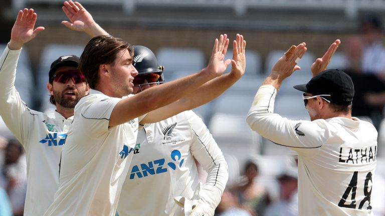 Zak Foulkes (L) celebrates with Tom Latham after bowling out Harry Brook during during day three of the third Test